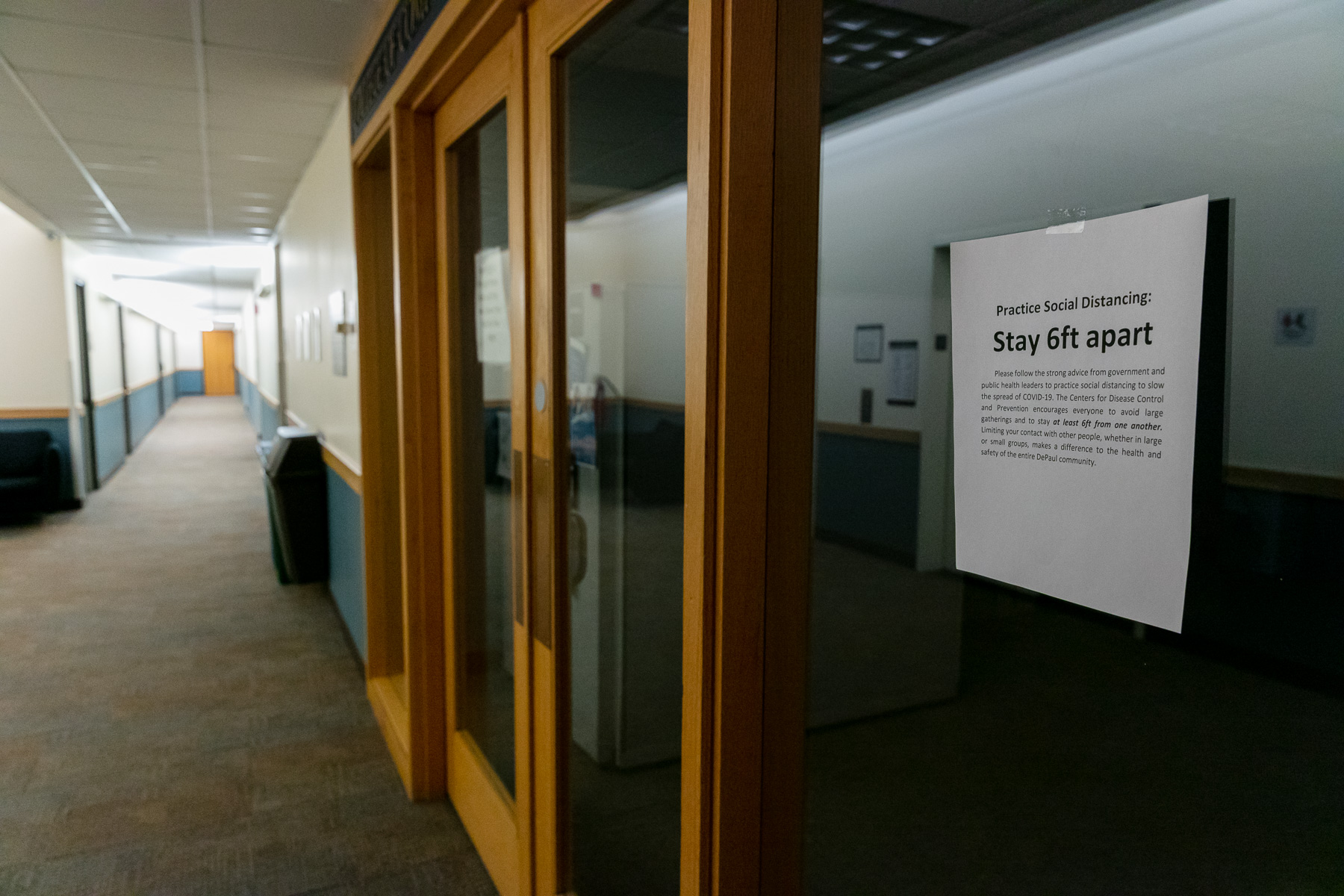 Signs hang outside many campus rooms emphasizing social-distancing of at least six feet. (DePaul University/Randall Spriggs)